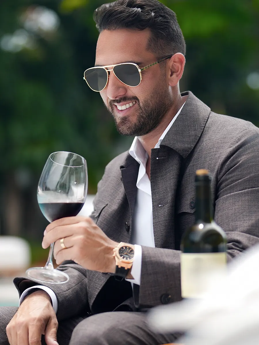 Roma, the jacket over an open white shirt