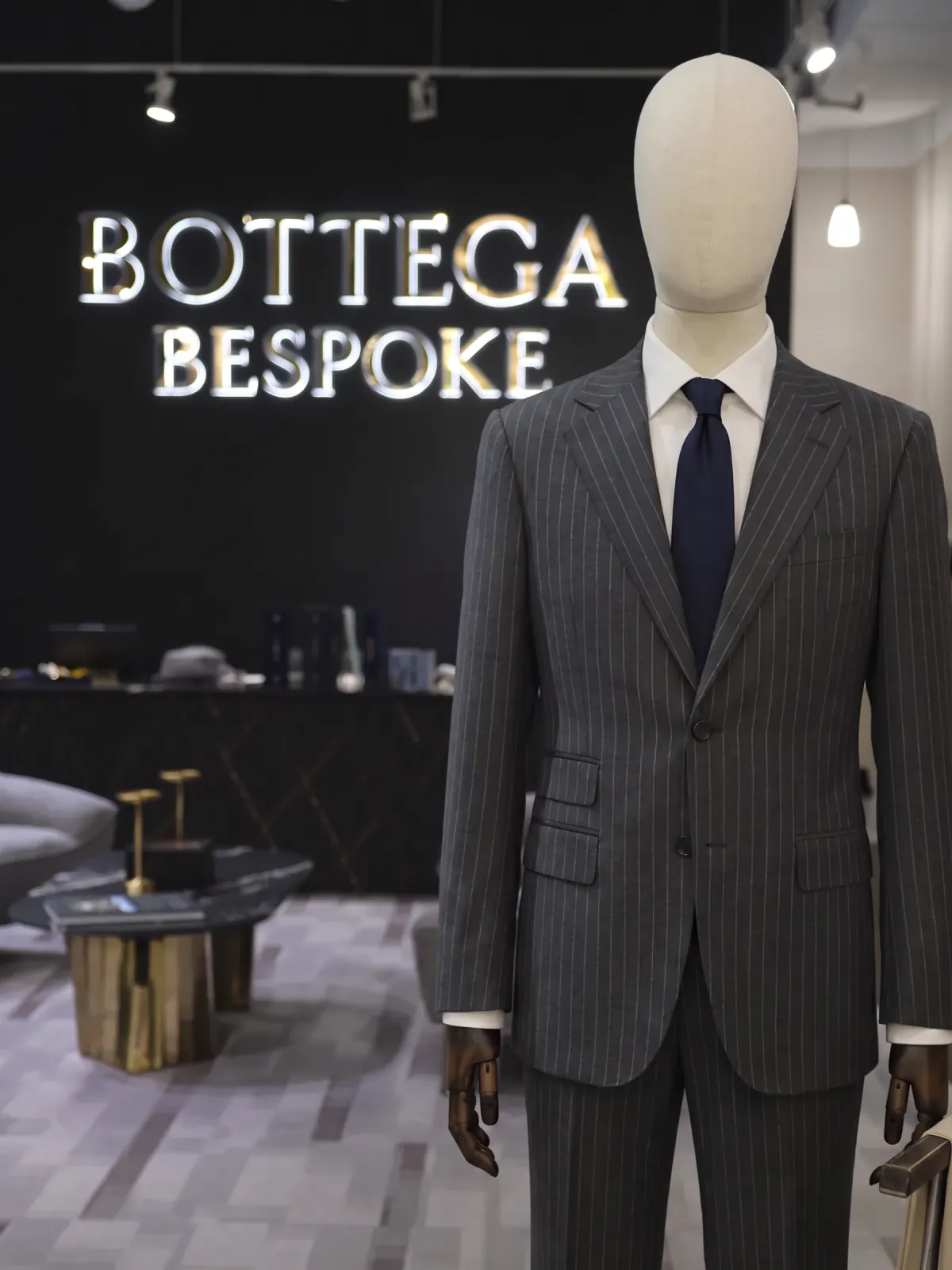 A grey pinstripe suit cut by Bottega Bespoke